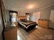 Main bedroom with wood flooring and a large mirrored dresser at 203 Shane Dr, Mount Holly, NC 28120