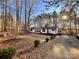 House exterior showcasing landscaping and a spacious yard at 203 Shane Dr, Mount Holly, NC 28120