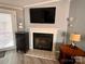 Modern fireplace with a flat screen TV above at 203 Shane Dr, Mount Holly, NC 28120