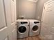 Laundry room with side-by-side Samsung washer and dryer at 203 Shane Dr, Mount Holly, NC 28120