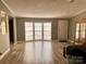 Bright living room with bay windows and wood flooring at 203 Shane Dr, Mount Holly, NC 28120