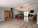 Spacious living room with wood floors and a view into the dining area at 203 Shane Dr, Mount Holly, NC 28120