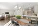 Farmhouse dining area with wooden table and view of living room at 2101 Morgan Hills Dr # 155P, Albemarle, NC 28001