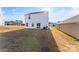 House's rear view, showcasing a yard and sliding glass door at 2513 Celestial Dr, Newton, NC 28568