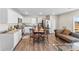 Modern kitchen with granite countertops, stainless steel appliances, and a breakfast table at 2513 Celestial Dr, Newton, NC 28568