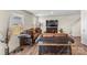 Living room with brown couches, glass-top coffee table, and hardwood floors at 2513 Celestial Dr, Newton, NC 28568