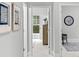 Hallway view to bedroom featuring wood floors and modern decor at 270 Gilead Rd, Huntersville, NC 28078