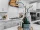 Close-up of the kitchen with stainless appliances and white countertops and cabinets at 270 Gilead Rd, Huntersville, NC 28078