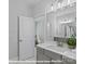 Bright main bathroom with grey vanity and a view to a main bedroom sitting area at 270 Gilead Rd, Huntersville, NC 28078