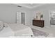 Neutral walls, patterned rug, and contemporary furniture add to the appeal of this light-filled main bedroom at 270 Gilead Rd, Huntersville, NC 28078