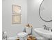 Lower level powder room with stylish fixtures and decorative wall art at 270 Gilead Rd, Huntersville, NC 28078