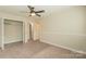 Bright bedroom with ample closet space and neutral carpeting at 315 Valley Brook Se Ln, Concord, NC 28025