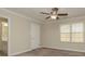 Spacious bedroom with neutral carpeting, ceiling fan, and ample closet space at 315 Valley Brook Se Ln, Concord, NC 28025