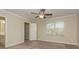 Bright bedroom with neutral walls, ceiling fan, and walk-in closet at 315 Valley Brook Se Ln, Concord, NC 28025