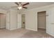 Well-lit bedroom featuring neutral carpet and two closets at 315 Valley Brook Se Ln, Concord, NC 28025