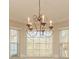 Ornate chandelier adds elegance to dining room or living space at 315 Valley Brook Se Ln, Concord, NC 28025