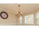 Bright dining room with chandelier and built-in window seat at 315 Valley Brook Se Ln, Concord, NC 28025