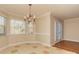 Elegant dining area with hardwood floors and french doors at 315 Valley Brook Se Ln, Concord, NC 28025