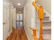 Light and airy entryway with stairs, wood floors, and doors to other rooms at 315 Valley Brook Se Ln, Concord, NC 28025