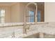 Close-up view of a modern kitchen faucet with a pull-down sprayer and granite countertop at 315 Valley Brook Se Ln, Concord, NC 28025