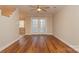 Living room with hardwood floors, ceiling fan, and French doors at 315 Valley Brook Se Ln, Concord, NC 28025