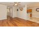 Open living space with hardwood floors and view into kitchen at 315 Valley Brook Se Ln, Concord, NC 28025