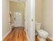 Small half bathroom with toilet and pedestal sink near entryway at 315 Valley Brook Se Ln, Concord, NC 28025