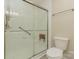 Large walk-in shower with glass doors and grab bars at 315 Valley Brook Se Ln, Concord, NC 28025