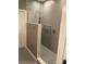 Modern shower with glass partition and handicap grab bar; note handheld shower head at 3818 Carl Parmer Dr, Harrisburg, NC 28075