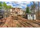 Backyard with shed, wooden table, and chicken coop at 3870 Elkwood Ct, Concord, NC 28025