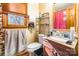 Bathroom with wood vanity and red shower curtain at 3870 Elkwood Ct, Concord, NC 28025