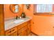 Bathroom with granite countertop and orange walls at 3870 Elkwood Ct, Concord, NC 28025