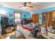 Bedroom with blue walls and wood closet doors at 3870 Elkwood Ct, Concord, NC 28025