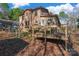 Two-story house with wooden deck and backyard at 3870 Elkwood Ct, Concord, NC 28025