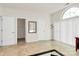 Well-lit bedroom with neutral walls, tile floor and two entry doorways at 4029 Wild Nursery Ct, Charlotte, NC 28215