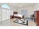 Bright bedroom featuring a ceiling fan and tile floor with black, geometric design at 4029 Wild Nursery Ct, Charlotte, NC 28215