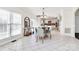 Open concept dining area with modern chairs and a large table, connecting to kitchen at 4029 Wild Nursery Ct, Charlotte, NC 28215