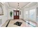 Formal dining room featuring a wooden china cabinet, large windows, and decorative flooring at 4029 Wild Nursery Ct, Charlotte, NC 28215