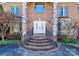 Elegant entrance with double doors, stone pillars, and a well-maintained brick staircase and wrought iron railings at 4029 Wild Nursery Ct, Charlotte, NC 28215