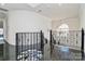 Hallway with beautiful ornamental metal staircase and railing at 4029 Wild Nursery Ct, Charlotte, NC 28215