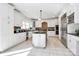 Bright kitchen with white cabinetry, stainless steel appliances, and functional center island at 4029 Wild Nursery Ct, Charlotte, NC 28215