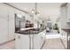 Open concept kitchen with white cabinetry, stainless steel appliances, and large center island at 4029 Wild Nursery Ct, Charlotte, NC 28215