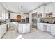 Spacious kitchen with white cabinetry, stainless steel appliances, and large center island at 4029 Wild Nursery Ct, Charlotte, NC 28215