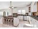 Bright kitchen with white cabinetry, granite countertops, stainless steel appliances, and a center island at 4029 Wild Nursery Ct, Charlotte, NC 28215