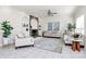 Comfortable living room featuring a stone fireplace, built-in shelving, and neutral decor at 4029 Wild Nursery Ct, Charlotte, NC 28215