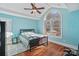 Light blue bedroom with hardwood floors and large window at 4070 Timber Crossing Dr, Rock Hill, SC 29730