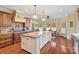 Bright kitchen boasts granite counters, custom cabinetry, and breakfast nook at 4070 Timber Crossing Dr, Rock Hill, SC 29730