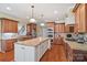 Eat-in kitchen featuring granite countertops, ample cabinetry, and hardwood floors at 4070 Timber Crossing Dr, Rock Hill, SC 29730