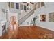 Two story living room with hardwood floors and open staircase at 4070 Timber Crossing Dr, Rock Hill, SC 29730