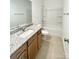 Bathroom with single vanity, granite countertop, and bathtub at 412 Catawba Ave, Davidson, NC 28036